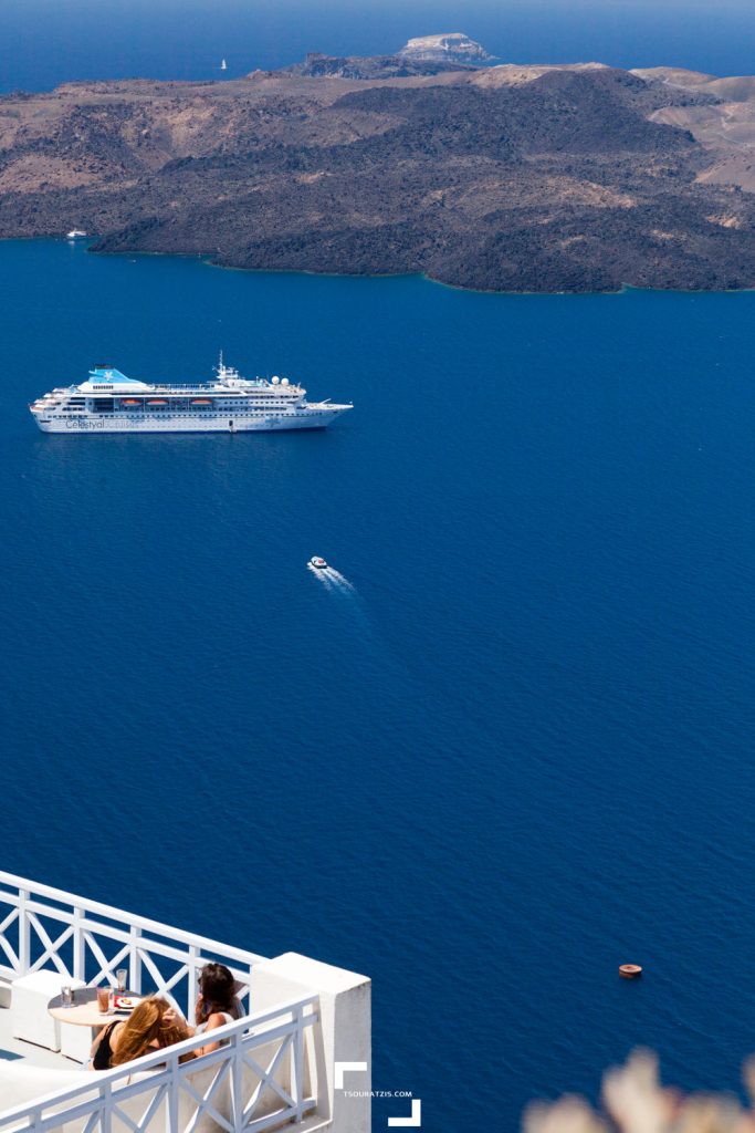 Enjoying view to Nea Kameni volcano Santorini island caldera