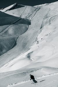 Anzère ski station red slope skier