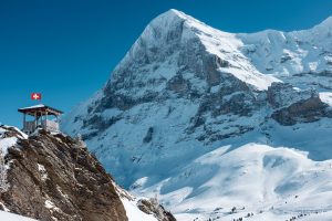 Jungfrau Eiger north face view and Swiss flag